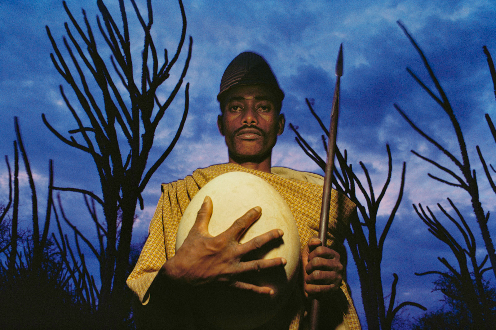 Antandroy tribesman with fossilized elephant bird egg, Southern Madagascar