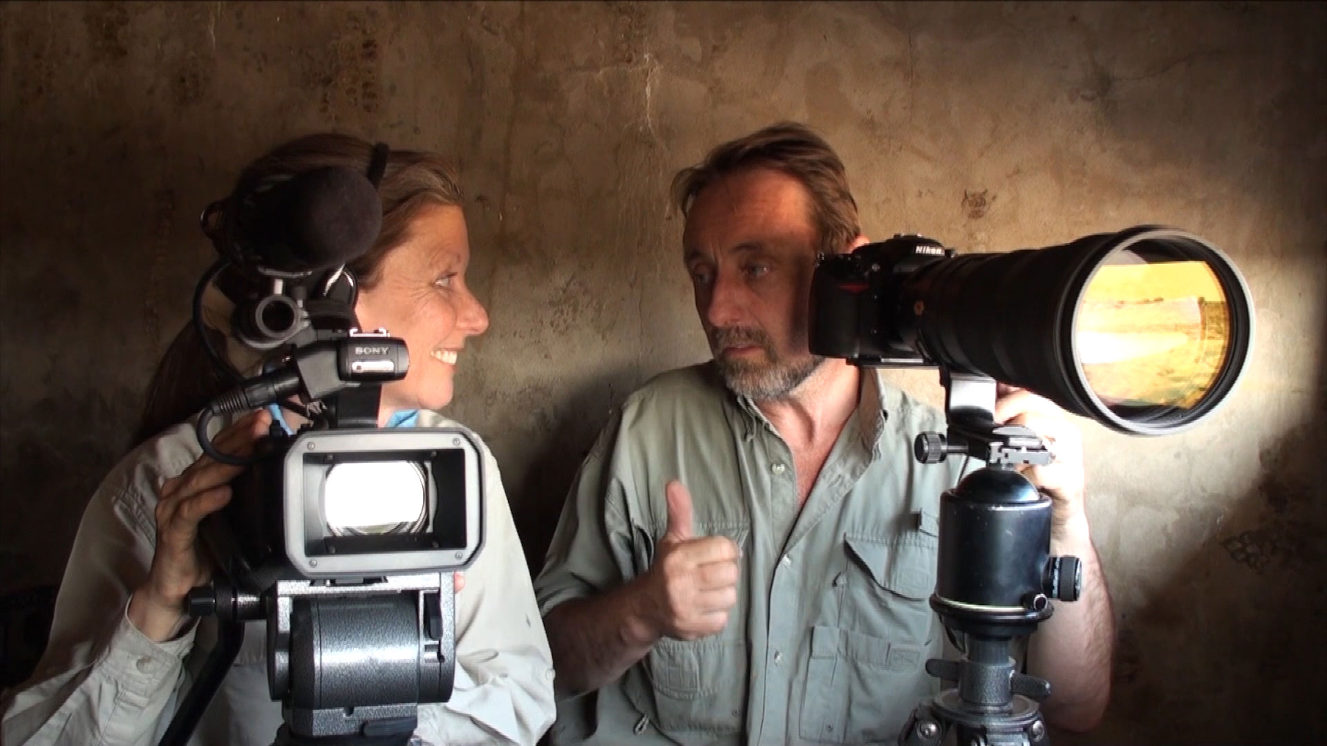 Frans Lanting and Christine Eckstrom in observation hideout, Etosha National Park, Namibia
